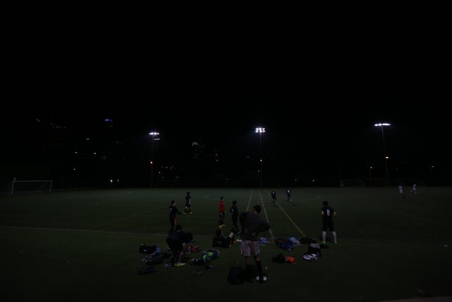 Nighttime Soccer Game Under the Lights