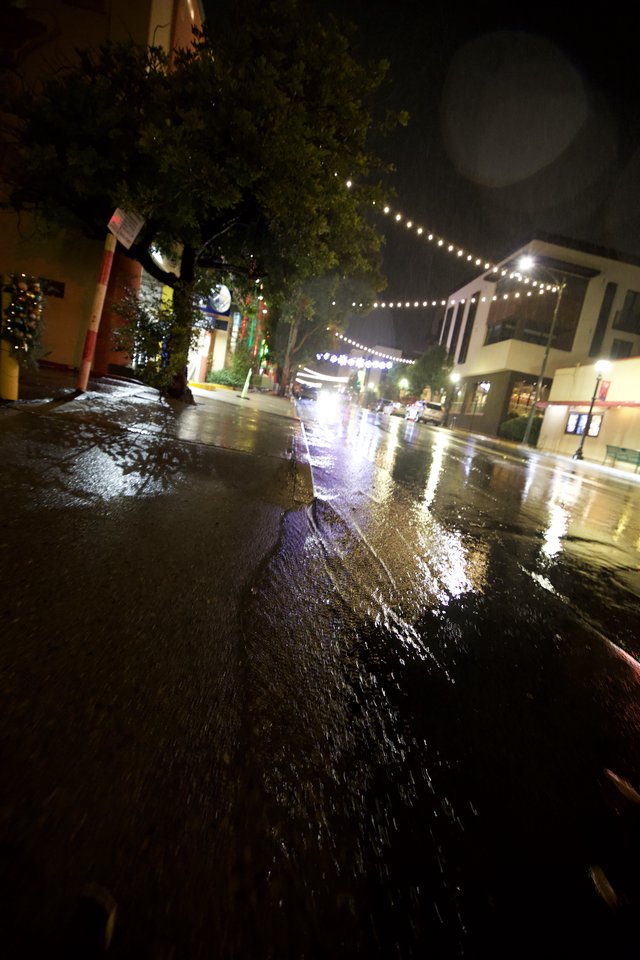 Rainy Night on an Illuminated Downtown Street