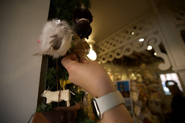 Decorating the Christmas Tree with Festive Ornaments