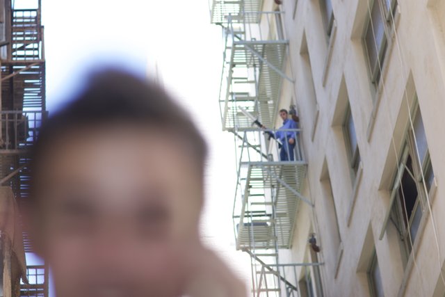 Blurry Man on Fire Escape