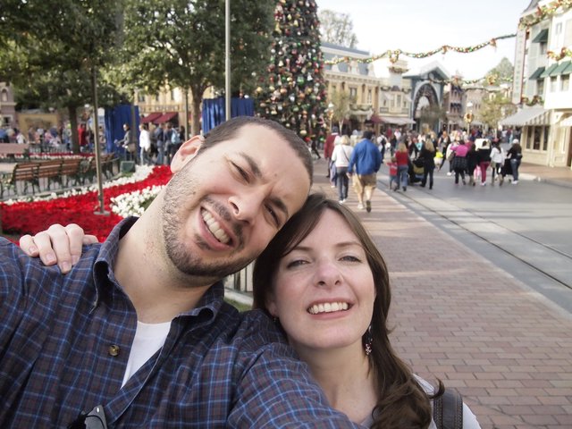 Couple's Joyful Selfie at Disneyland Christmas Celebration