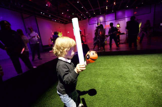 Child with Lightsaber at Baby Rave Event