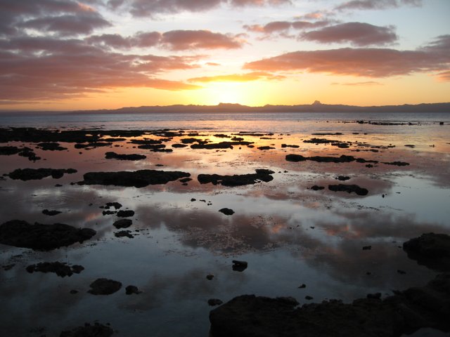 Majestic Sunset Over Rocky Shore