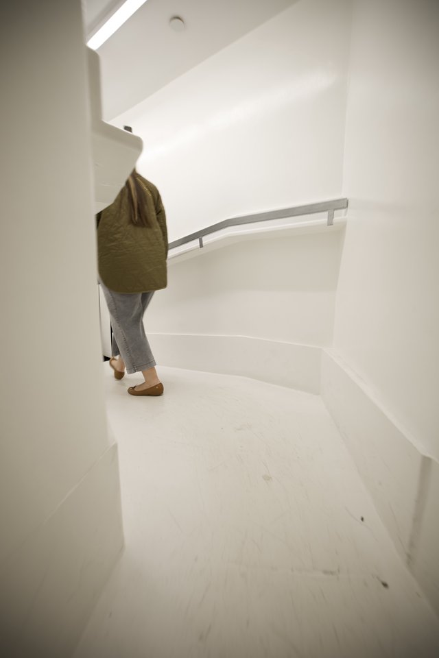 Ascending the Minimalist White Spiral Staircase