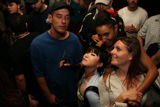 Late Night Club Crowd Having Fun Together