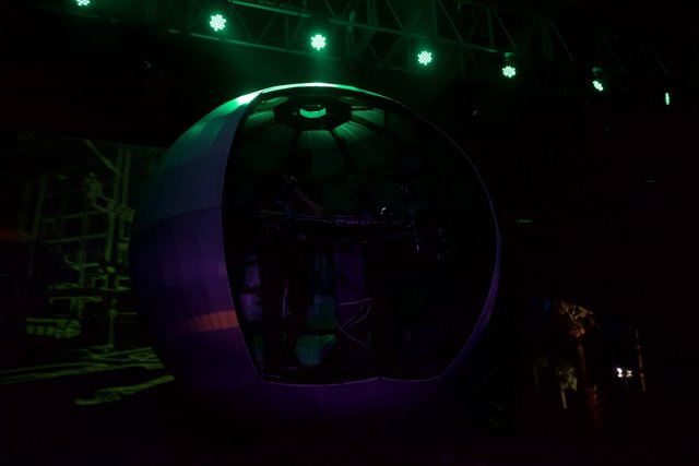 Green and Purple Stage Lights Illuminate Concert