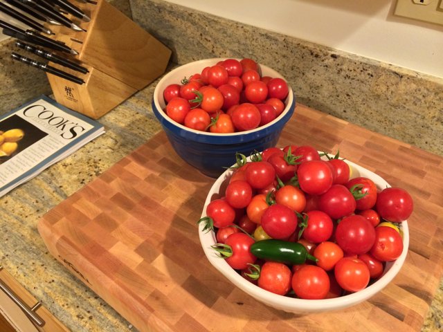 Fresh Tomatoes on Wooden Cutting Board