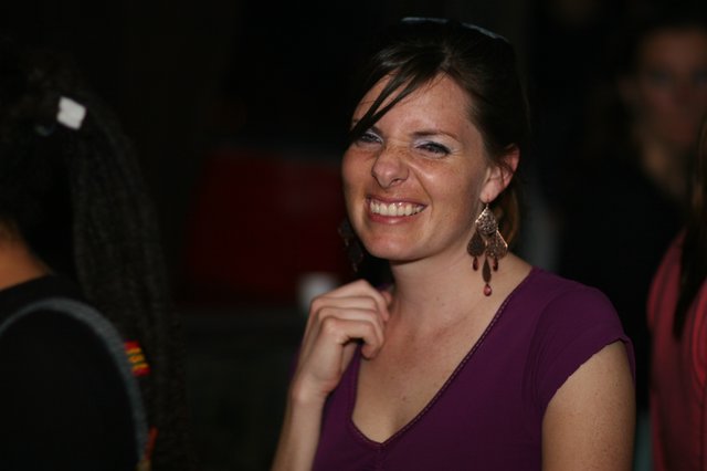 Radiant Smile at a Nighttime Social Gathering