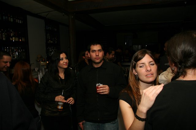 Friends Socializing at a Dimly Lit Bar Night