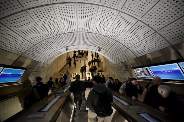 Rush Hour Commuters on London Underground Escalator