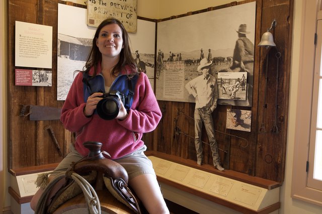 Photographer Poses on Saddle at Western Ranch Museum