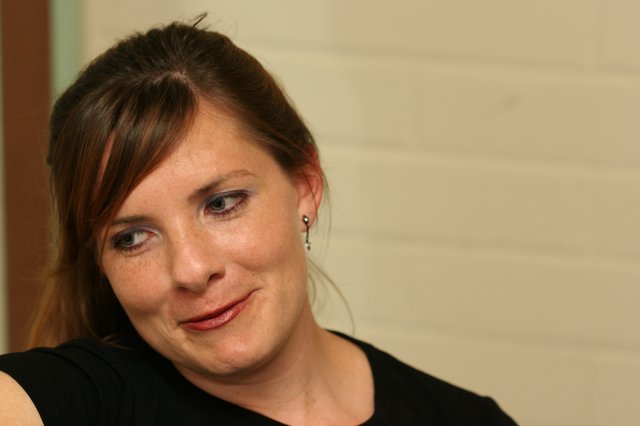 Candid Portrait of Woman in Thoughtful Smile