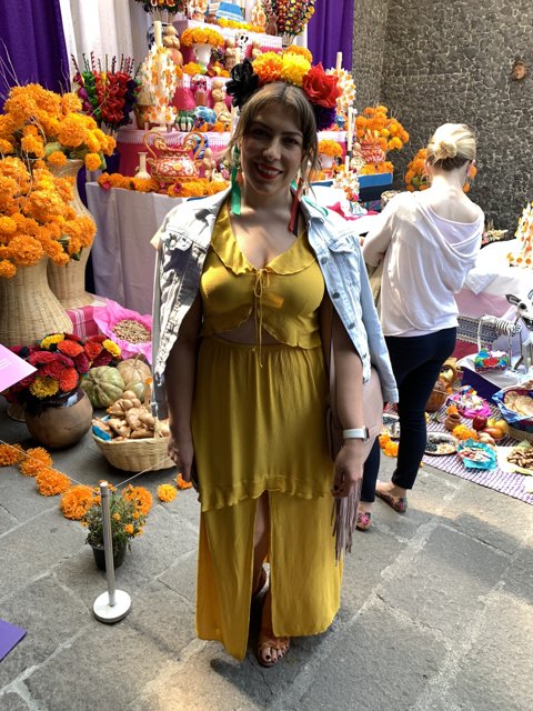 A Woman's Yellow Summer Dress and Flower Bouquet