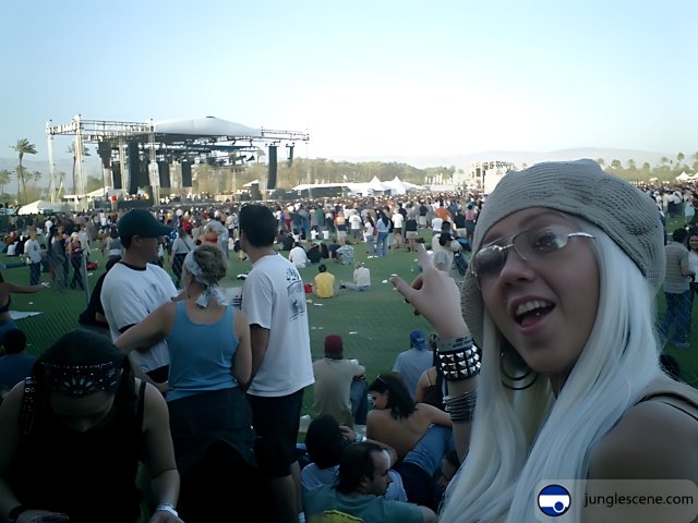 Woman with White Hair and Glasses in Front of a Crowd at Coachella
