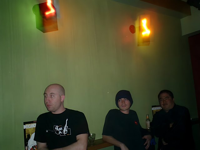 Three Men Enjoying a Drink at the Bar