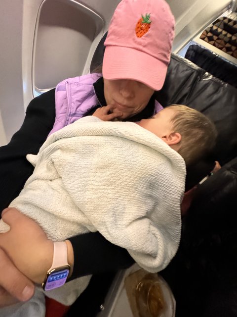First Flight: Mother and Newborn at Barbara Jordan Terminal, Austin, Texas