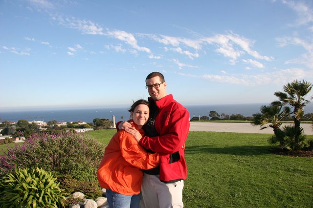 Couple Embracing with Ocean View Behind Them