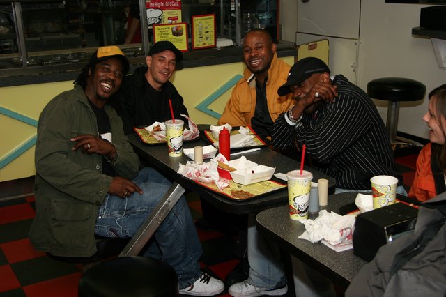 Friends Laughing Together at a Burger Joint