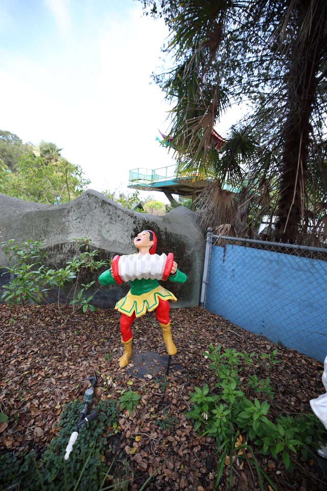Vintage Strongman Figure at Abandoned Amusement Area