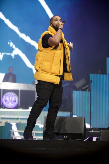 Drake performs solo on Coachella stage in yellow vest