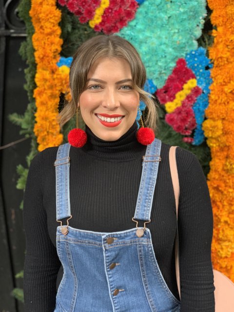 Smiling Woman in Overalls