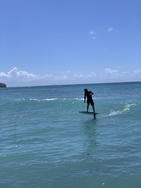 Riding the Waves at Waikiki Beach