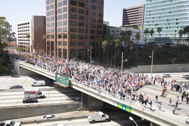Mayday Rally Draws Crowds to City Overpass