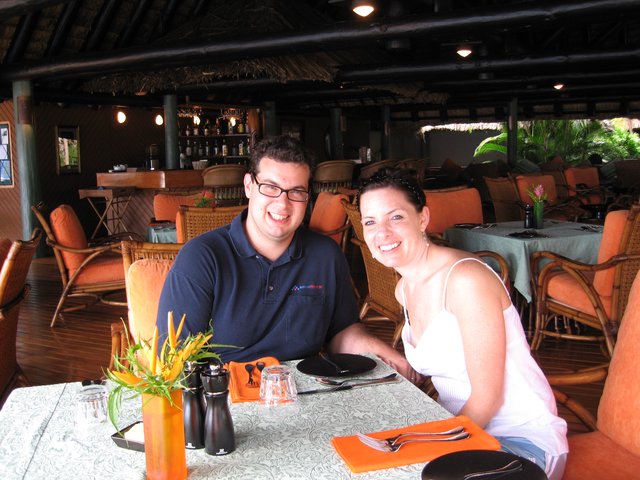 Couple Smiling at Tropical Resort Restaurant Dinner