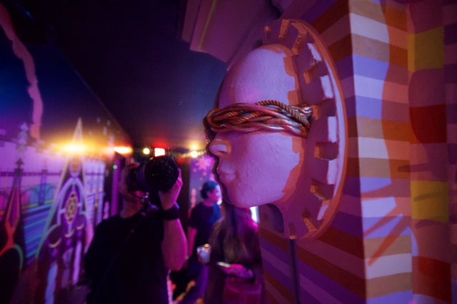 Illuminated Art Installation with Sculptural Elements and Atmospheric Lighting