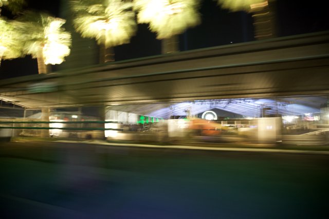 Blurred train passing by an overpass