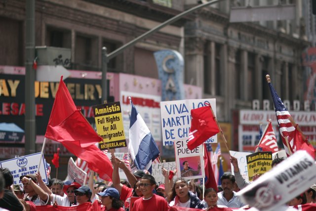 Parade of People Holding Signs and Flags in Support of Hugo Chávez