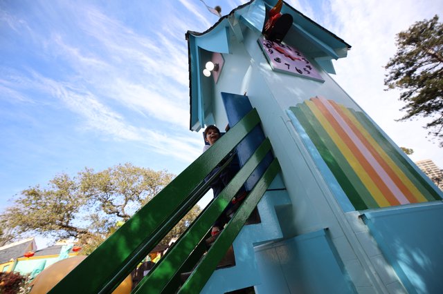 Whimsical Treehouse Playground with Rainbow Details