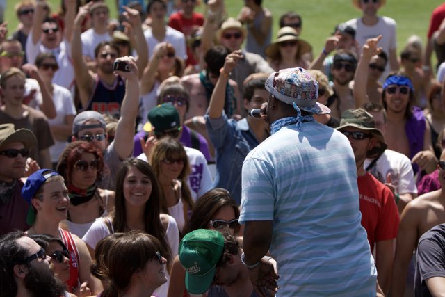 Man in a Baseball Cap in Coachella Crowd