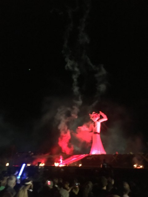 Fiery Statue at Night