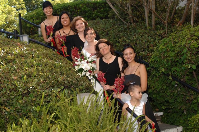 Bridal Party Poses on Garden Staircase with Bouquets
