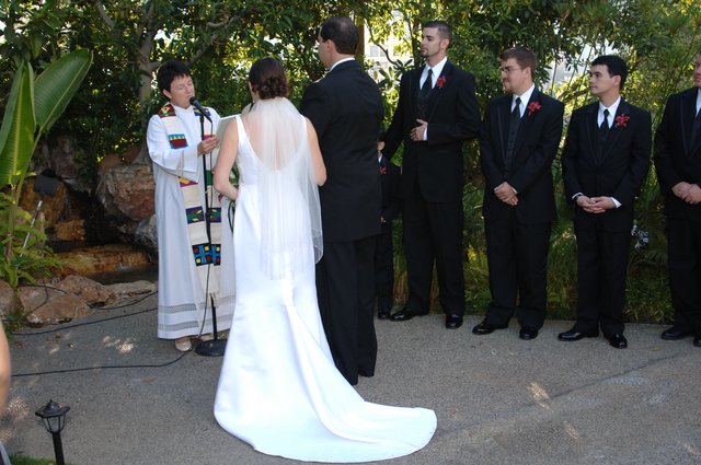 Outdoor Wedding Ceremony with Groomsmen and Officiant