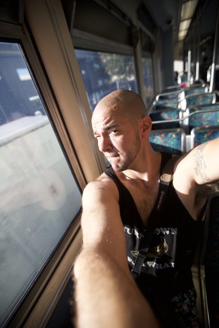 Tattooed Man on the Bus