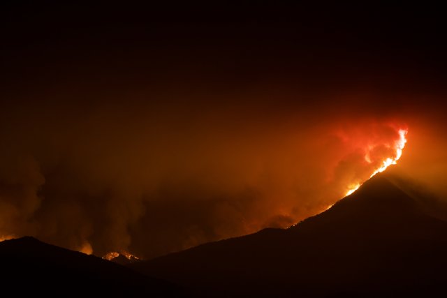 Nighttime Blaze in the Mountains