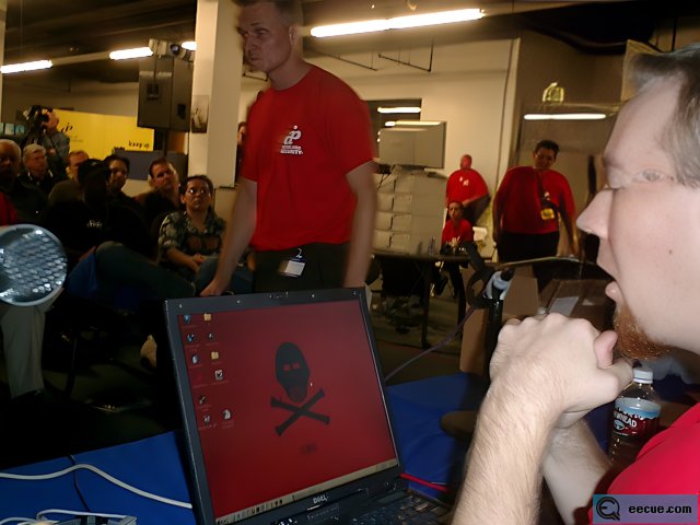 Man in Red Shirt Working on Laptop