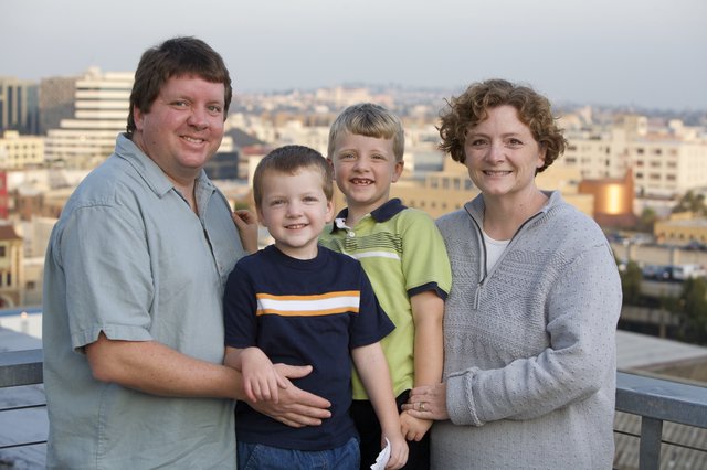 Family Portrait on Urban Rooftop at Dusk