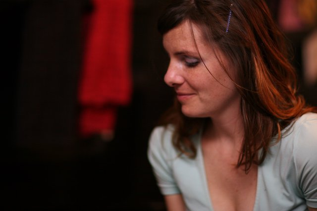 Pensive Woman in Soft Light at Evening Venue