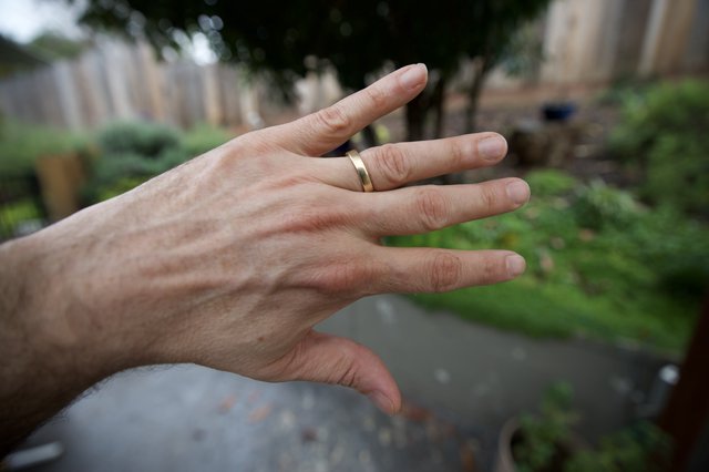 Hand with Wedding Ring in Garden Setting