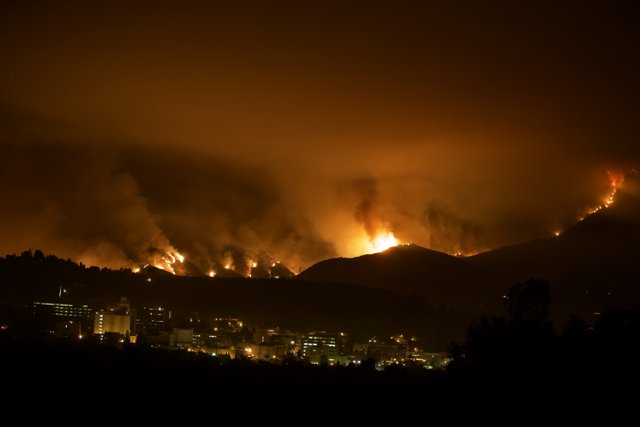 Flames Engulf the Hills Above the City