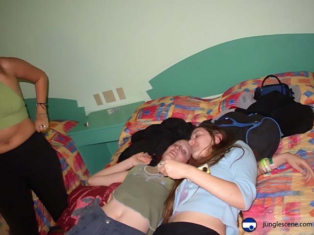 Female Bonding on a Cozy Bed