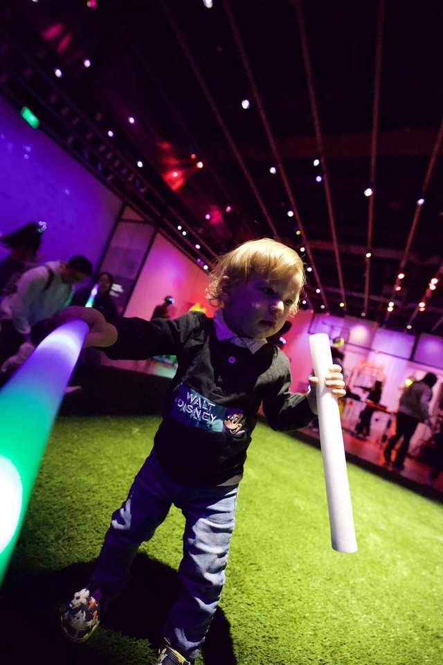 Toddler Dancing with Light Stick at Baby Rave