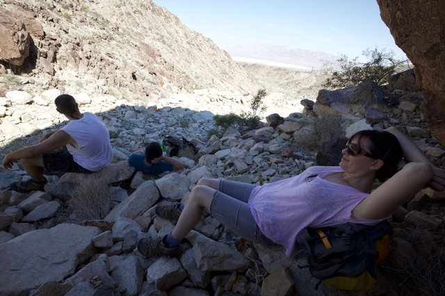 Hikers Resting in a Rocky Desert Canyon