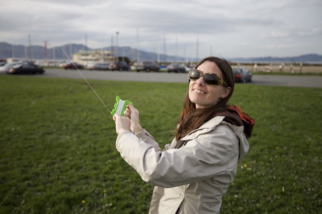 Woman Flying a Kite at San Francisco Waterfront