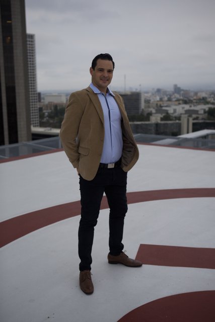 Rooftop Man with Cityscape View