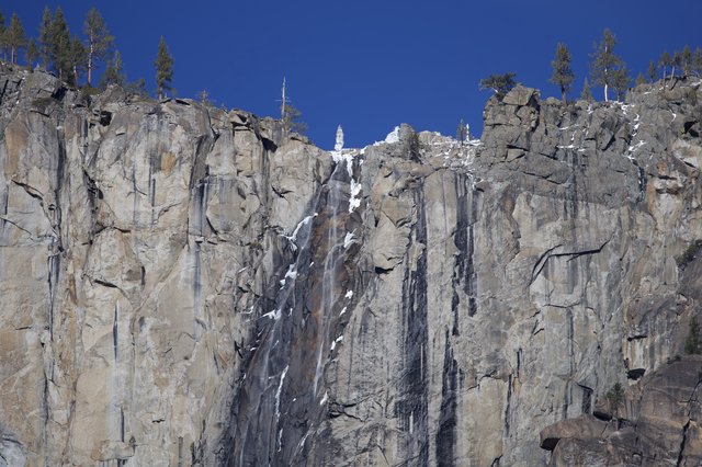 Frozen Waterfall Cascading Down Yosemite's Granite Cliffs