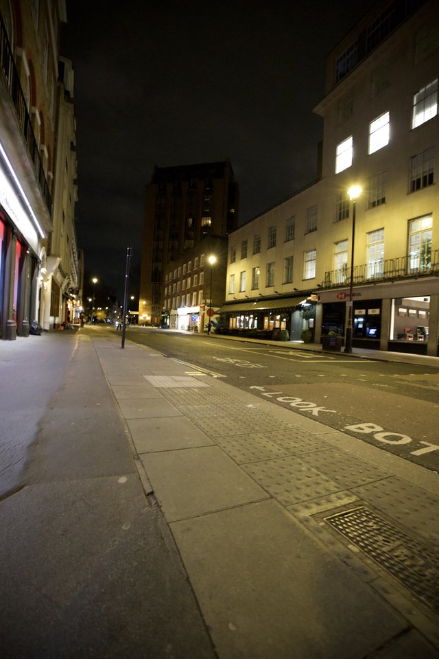 Quiet London Street at Night with Illuminated Buildings